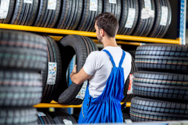 Mechanic selecting the new tyres